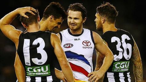 Patrick Danger laughs it up with Scott pendlebury after their round 2 clash. Image Wayne Ludbey News Limited