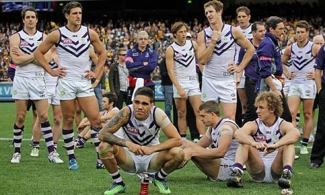 AFL Grand Final at the MCG / Fremantle Dockers Vs the Hawthorne Hawks: Dejected Dockers after losing the 2013 Grand Final to Hawthorn. Image courtesy Michael Wilson, AAP
